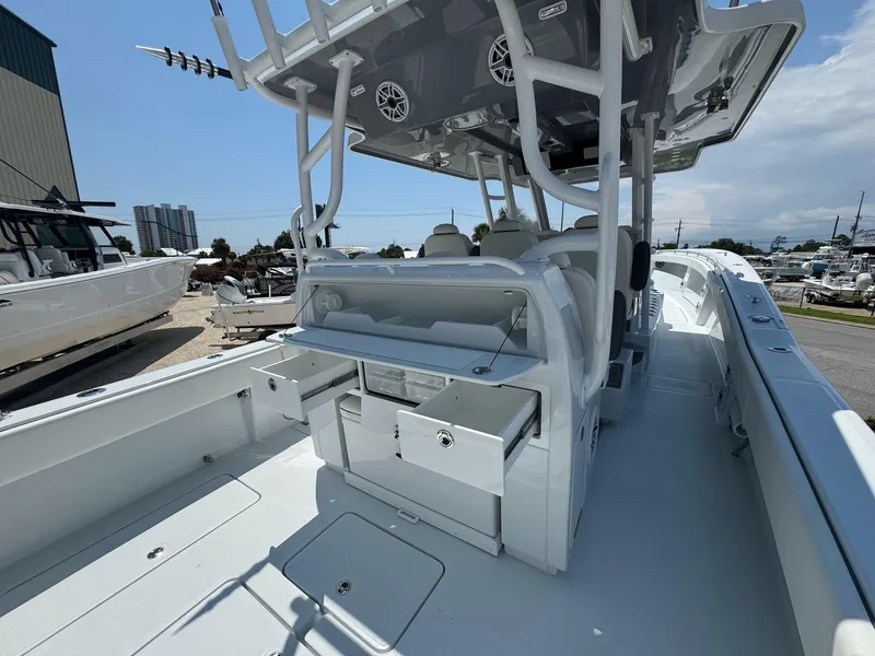 Slide: The Image of 2026 Invincible 43 Open Fisherman boat interior with storage compartments and seating. - 38