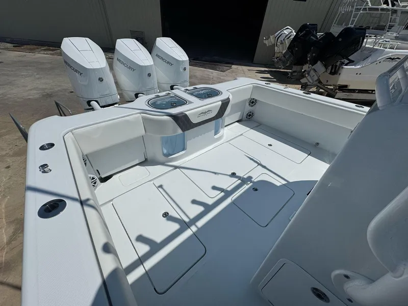 Slide: The Image of 2026 Invincible 43 Open Fisherman boat with triple Mercury engines, spacious deck layout. - 39