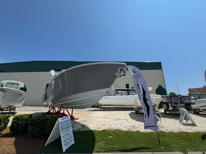 Slide: The Image of 2026 Invincible 43 Open Fisherman boat displayed outdoors under clear blue sky. - 4