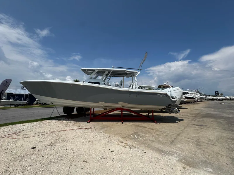 Slide: The Image of 2026 Invincible 43 Open Fisherman boat displayed outdoors under a clear sky. - 5