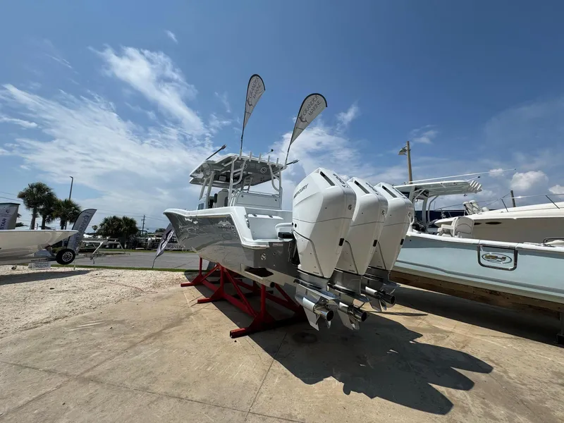 Slide: The Image of 2026 Invincible 43 Open Fisherman boat with triple outboard engines on display. - 7