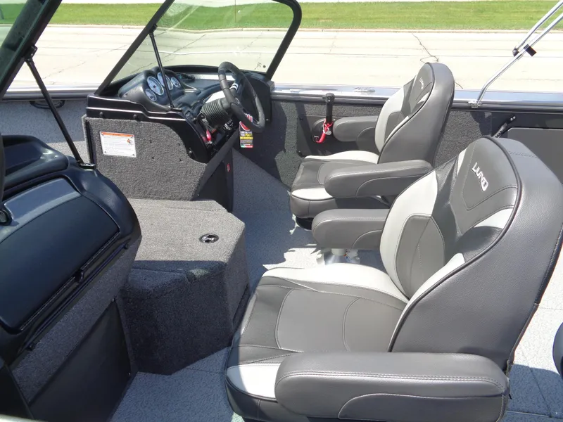 Slide: The Image of 2025 Lund 2075 Fisherman boat interior with modern seating and dashboard. - 10