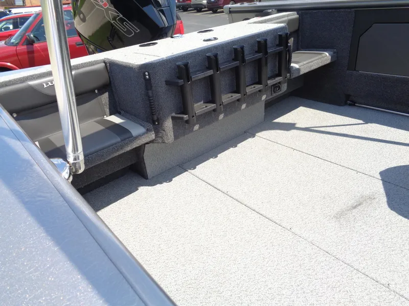 Slide: The Image of 2025 Lund 2075 Fisherman boat interior with rod holders and seating. - 13