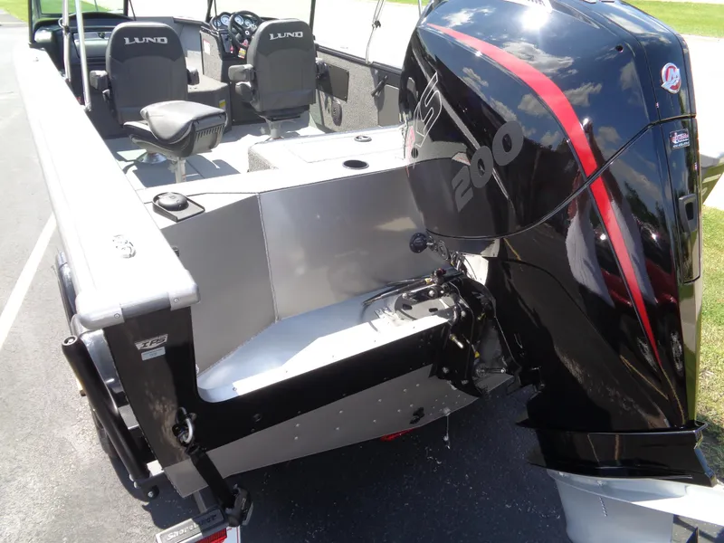 Slide: The Image of 2025 Lund 2075 Fisherman boat with powerful outboard motor and spacious seating. - 14