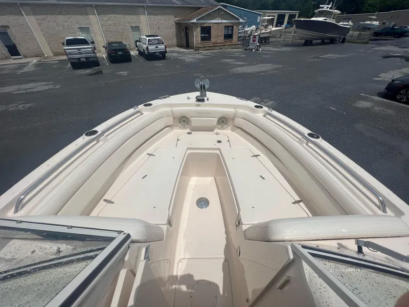 Slide: The Image of 2019 Grady-White Freedom 235 boat interior, showcasing spacious seating and sleek design. - 8