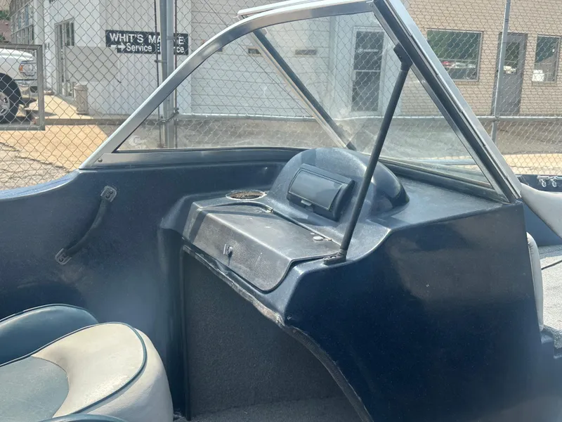 Slide: The Image of 2007 Stratos 486 Ski-N-Fish boat interior with dashboard and seating. - 12