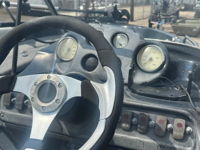 Slide: The Image of Steering wheel and dashboard of 2007 Stratos 486 Ski-N-Fish boat. - 13