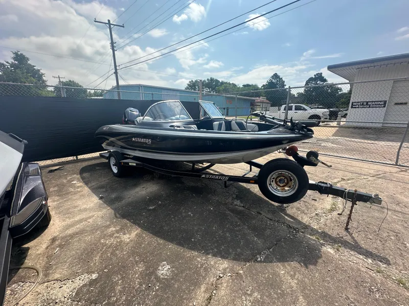 Slide: The Image of 2007 Stratos 486 Ski-N-Fish boat on trailer in outdoor lot. - 4