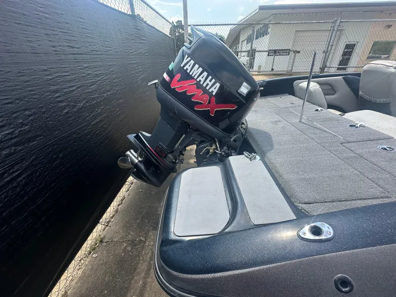 Slide: The Image of 2007 Stratos 486 Ski-N-Fish boat with Yamaha VMAX outboard motor, parked outdoors. - 6