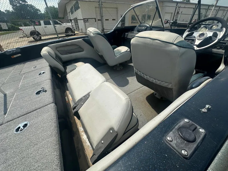 Slide: The Image of 2007 Stratos 486 Ski-N-Fish boat interior with seating and steering wheel. - 8