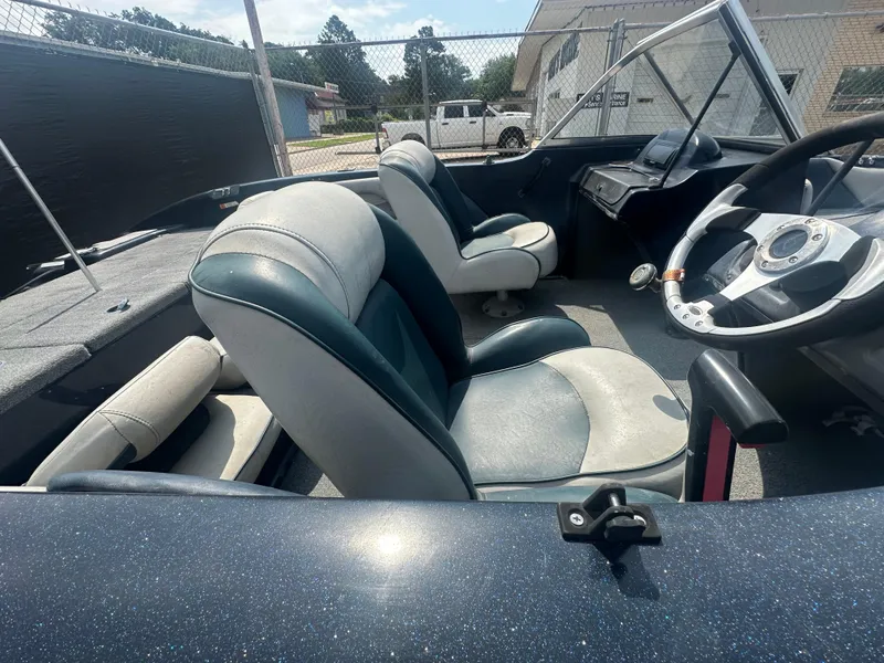 Slide: The Image of 2007 Stratos 486 Ski-N-Fish boat interior with steering wheel and seating. - 9