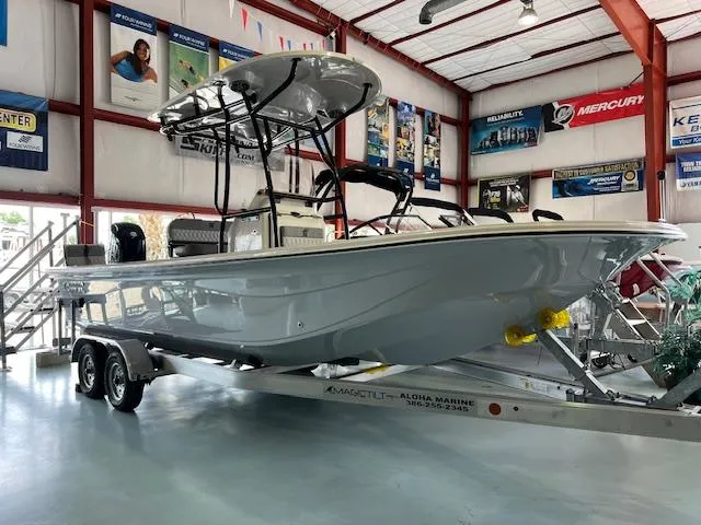 The Image of 2025 Carolina Skiff 23 LS boat on trailer in showroom. - 1