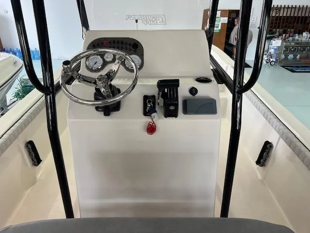 Slide: The Image of 2025 Carolina Skiff 23 LS boat console with steering wheel and controls. - 5