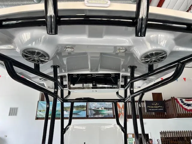 Slide: The Image of 2025 Carolina Skiff 23 LS boat interior with speakers and black frame. - 6