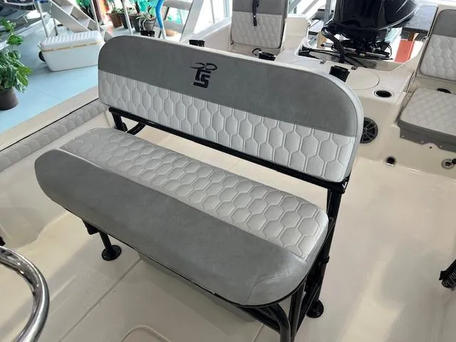Slide: The Image of 2025 Carolina Skiff 23 LS boat interior with stylish gray and white seating. - 7