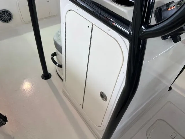 Slide: The Image of 2025 Carolina Skiff 23 LS boat interior with storage compartment and seating. - 8