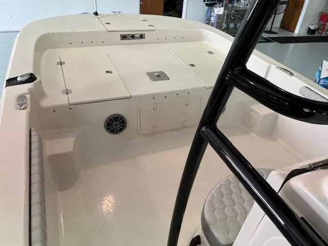 Slide: The Image of 2025 Carolina Skiff 23 LS boat interior with seating and storage compartments. - 9