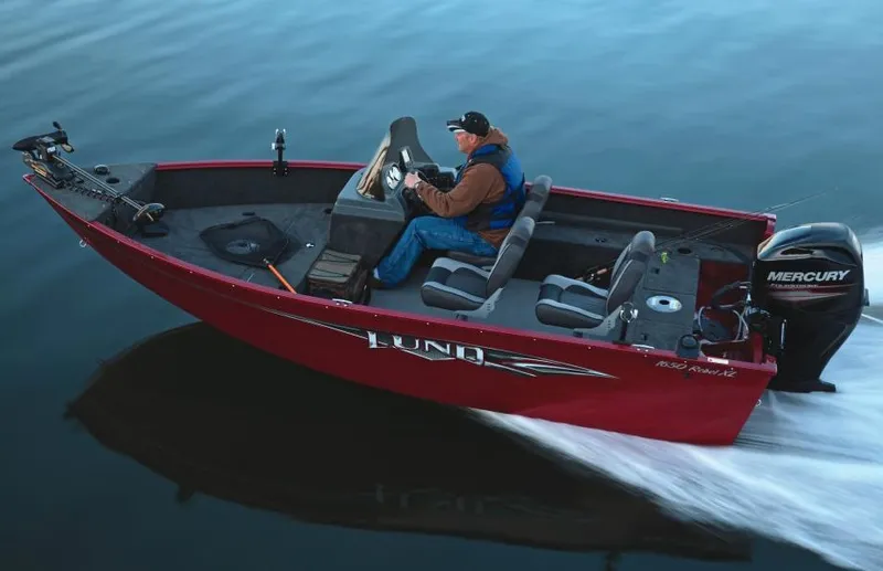 Slide: The Image of Manufacturer Provided Image: 2014 Lund 1650 Rebel XL SS boat cruising on water. - 24