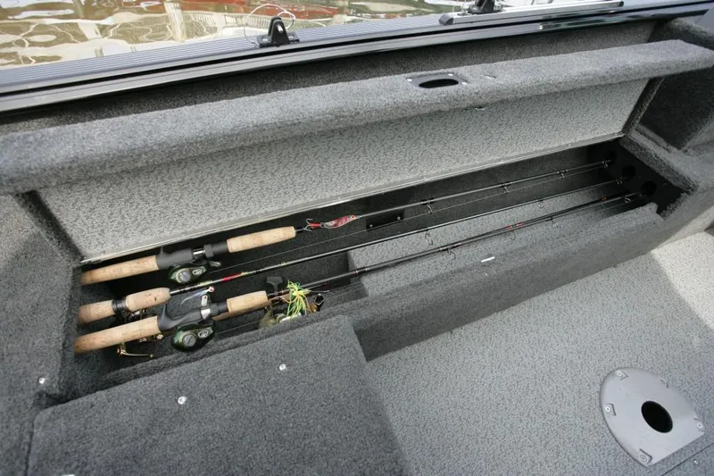 Slide: The Image of Manufacturer Provided Image: 2014 Lund 1650 Rebel XL SS fishing rod storage compartment. - 25