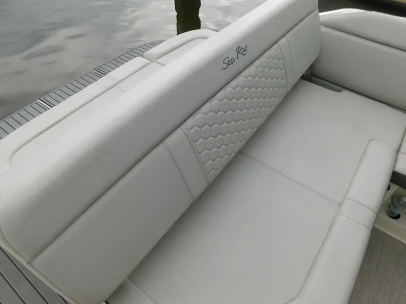 Slide: The Image of 2021 Sea Ray SDX 250 boat seat with elegant white upholstery and hexagonal pattern. - 19