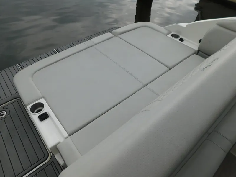 Slide: The Image of 2021 Sea Ray SDX 250 boat with spacious rear seating and cup holders. - 20