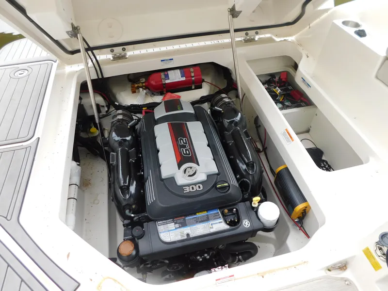 Slide: The Image of Engine compartment of 2021 Sea Ray SDX 250 boat, featuring a 6.2L 300 HP engine. - 21