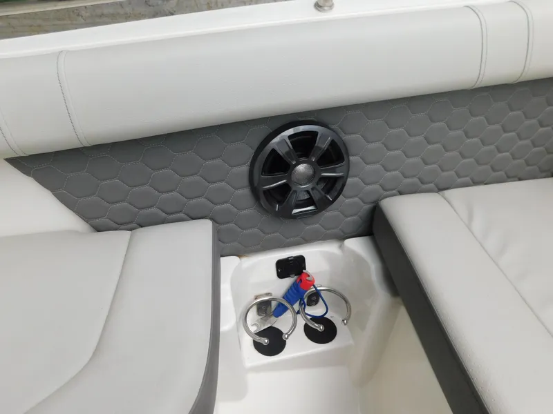 Slide: The Image of Interior of 2021 Sea Ray SDX 250 boat with speaker and cup holders. - 9
