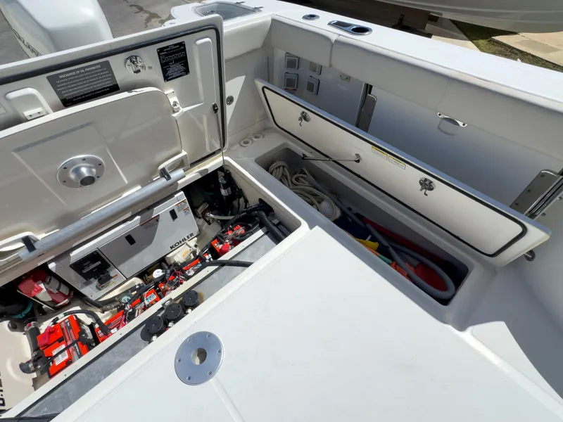 Slide: The Image of 2018 Boston Whaler 315 Conquest boat storage compartments and equipment. - 21