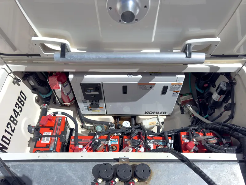 Slide: The Image of Engine compartment of 2018 Boston Whaler 315 Conquest with Kohler generator and batteries. - 23