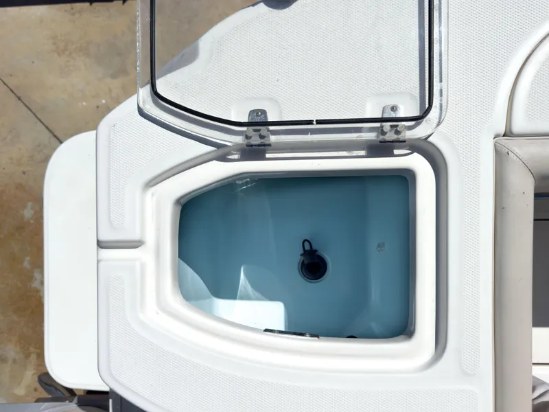 Slide: The Image of Open storage compartment on 2018 Boston Whaler 315 Conquest boat. - 24