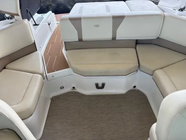 Slide: The Image of 2018 Regal 2000 ES Bowrider interior with beige seating and carpeted flooring. - 11