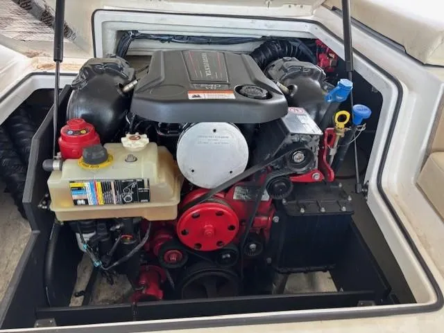 Slide: The Image of Engine compartment of a 2018 Regal 2000 ES Bowrider boat, showcasing detailed components. - 12