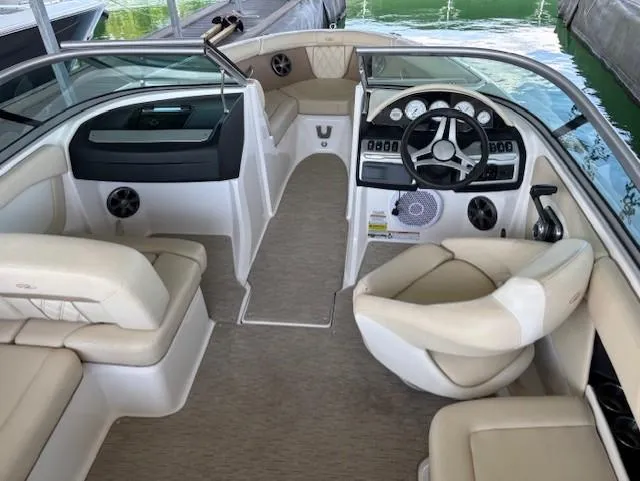Slide: The Image of 2018 Regal 2000 ES Bowrider interior with beige seating and modern dashboard. - 6