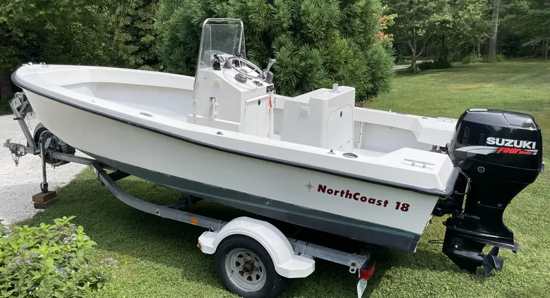 Slide: The Image of 2006 NorthCoast 180 Center Console boat with Suzuki outboard motor on trailer. - 1