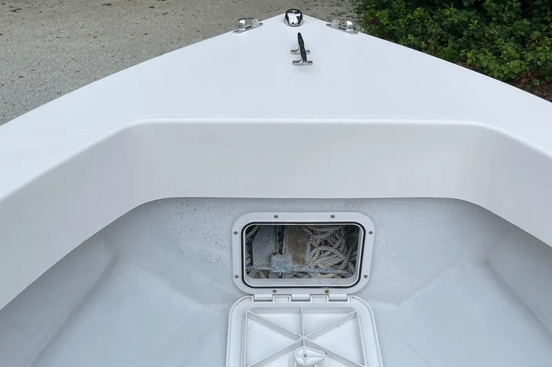 Slide: The Image of 2006 NorthCoast 180 Center Console boat bow with open storage compartment. - 5