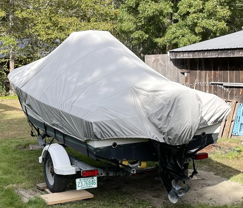 Slide: The Image of Covered 2006 NorthCoast 180 Center Console boat on trailer in yard. - 7