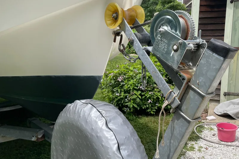 Slide: The Image of 2006 NorthCoast 180 Center Console boat on trailer with winch and covered tire. - 9