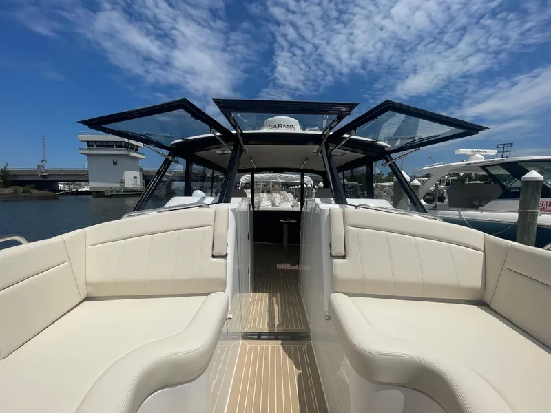 Slide: The Image of 2025 MJM 3 luxury boat with open sunroof and spacious seating. - 18