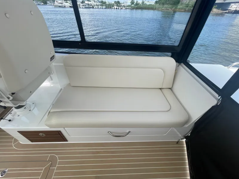 Slide: The Image of Interior seating of 2025 MJM 3 boat with waterfront view. - 33