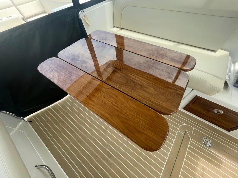 Slide: The Image of Luxurious wooden table in the 2025 MJM 3 boat interior. - 38