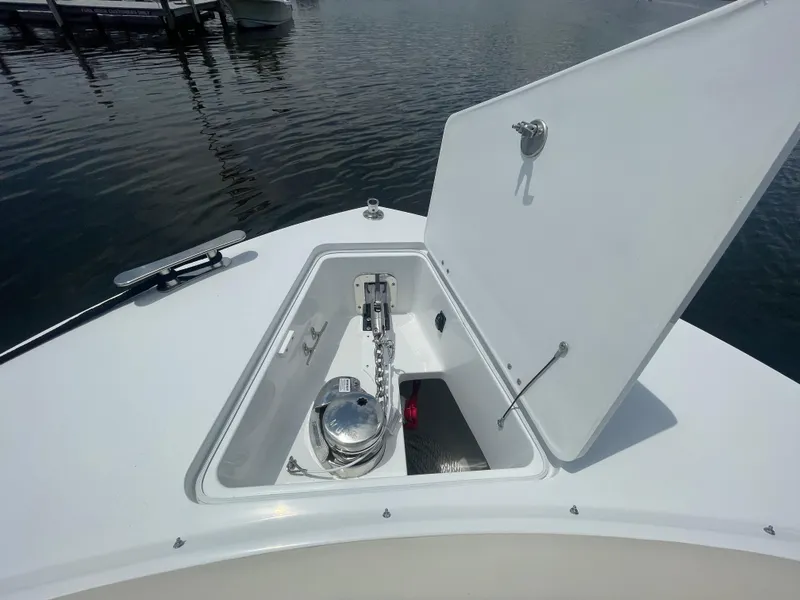 Slide: The Image of Open anchor locker on the 2025 MJM 3 boat, docked by the water. - 8