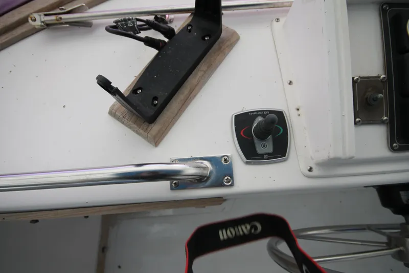 Slide: The Image of Control panel of a 1986 Senator 35 Sundeck Trawler boat with steering wheel. - 16