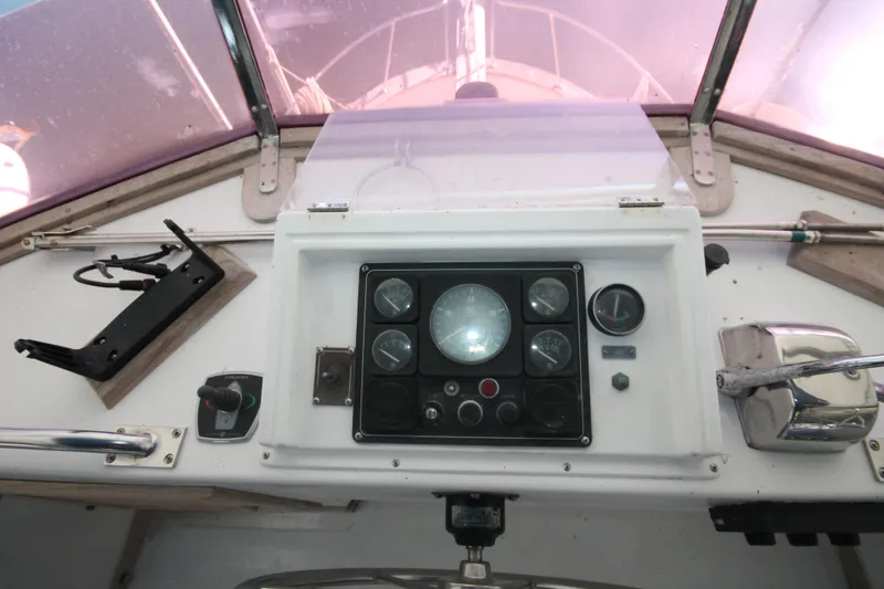 Slide: The Image of 1986 Senator 35 Sundeck Trawler helm with gauges and controls. - 17