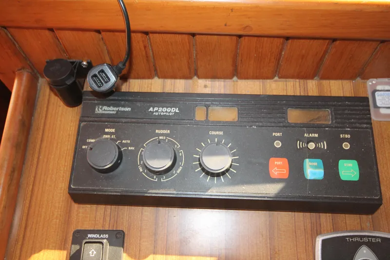 Slide: The Image of Control panel of a 1986 Senator 35 Sundeck Trawler with autopilot system. - 19