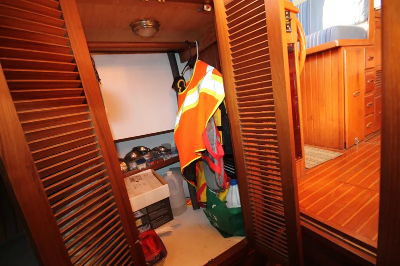 Slide: The Image of 1986 Senator 35 Sundeck Trawler interior with storage area and safety gear. - 29