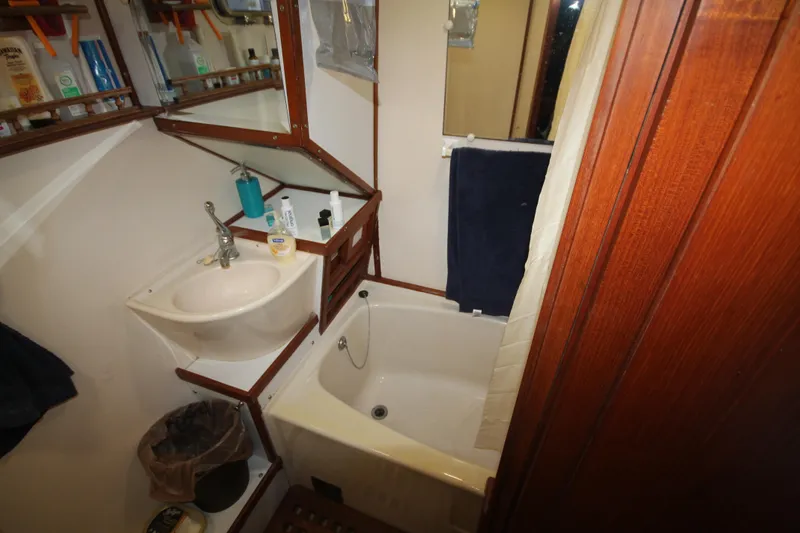 Slide: The Image of Bathroom interior of 1986 Senator 35 Sundeck Trawler with sink and bathtub. - 33