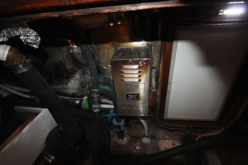 Slide: The Image of Engine room of a 1986 Senator 35 Sundeck Trawler with mechanical components. - 41