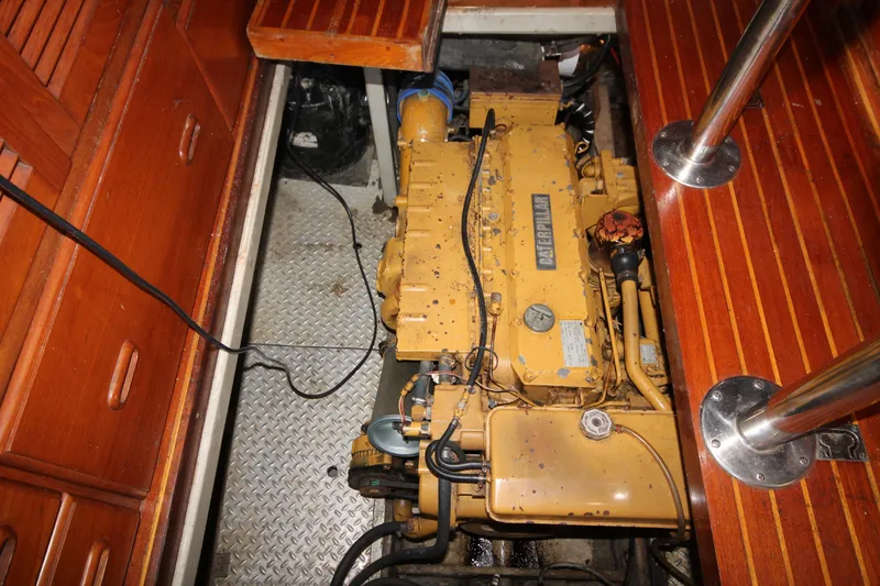 Slide: The Image of Engine compartment of 1986 Senator 35 Sundeck Trawler with visible yellow engine. - 44