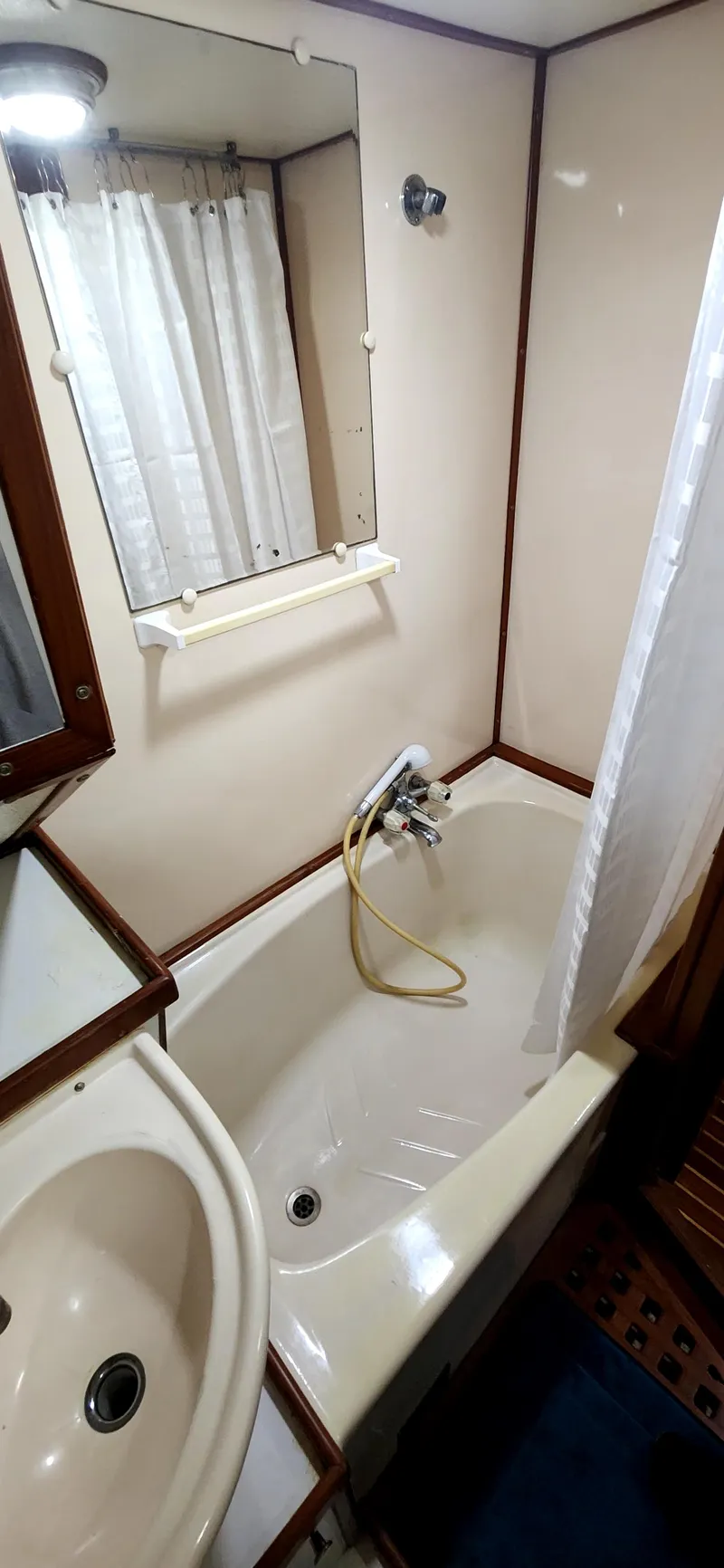 Slide: The Image of Bathroom interior of 1986 Senator 35 Sundeck Trawler with bathtub and sink. - 48