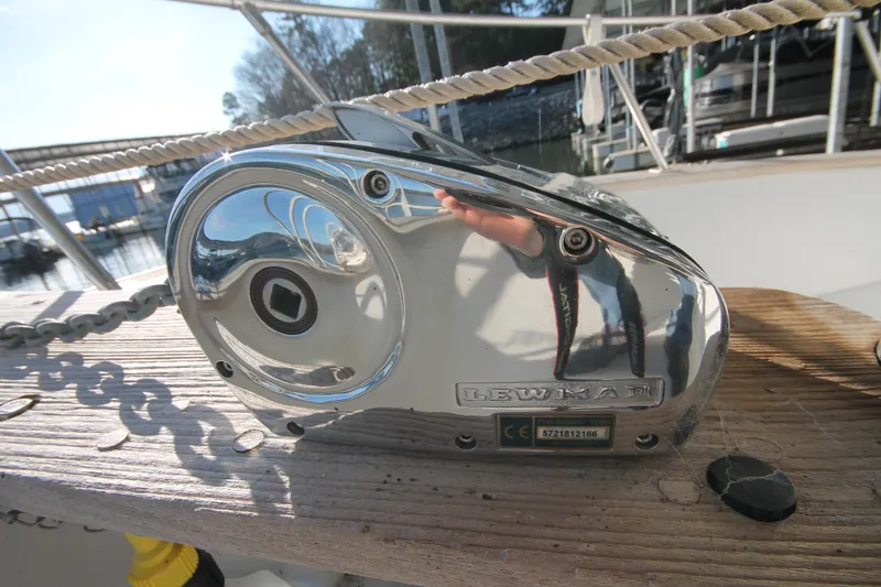Slide: The Image of Chrome winch on 1986 Senator 35 Sundeck Trawler, reflecting surroundings. - 7